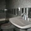 Finish plumbing in basement bathroom floor with granite